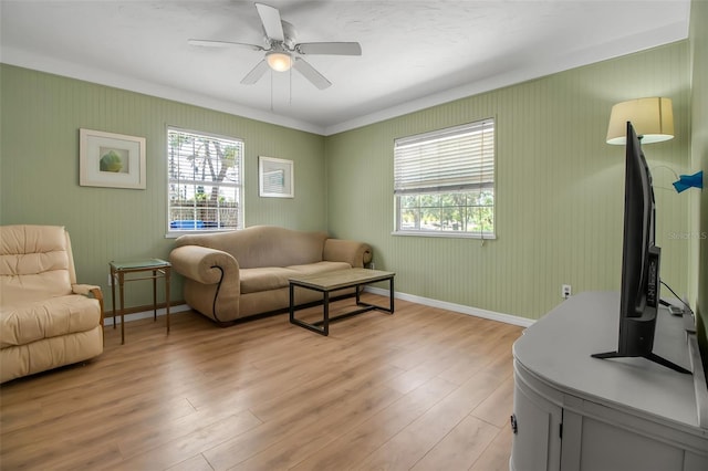 951 Varet Rd, Venice, FL 34293 - living room with plenty of natural light, light wood-style floors, a ceiling fan, baseboards, and ornamental molding
