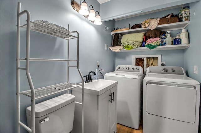 951 Varet Rd, Venice, FL 34293 - washroom with independent washer and dryer and wood finished floors