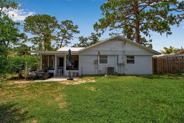 951 Varet Rd, Venice, FL 34293 - rear view of property featuring cooling unit, a patio area, and a sunroom