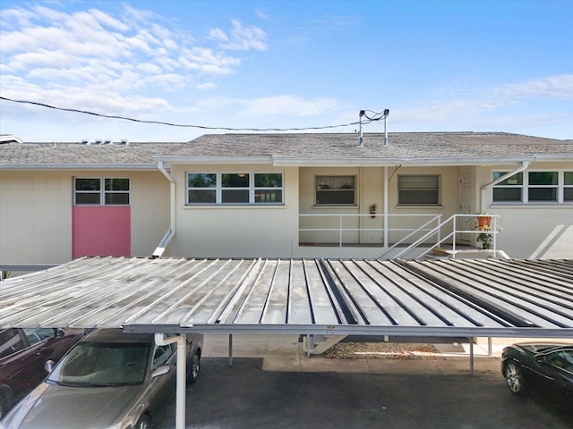 2503 Beneva Rd Unit 7, Sarasota, FL 34232 - view of front of home with a shingled roof and stucco siding