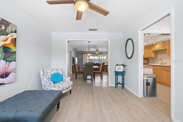 2503 Beneva Rd Unit 7, Sarasota, FL 34232 - sitting room featuring ceiling fan, light wood-style flooring, and baseboards