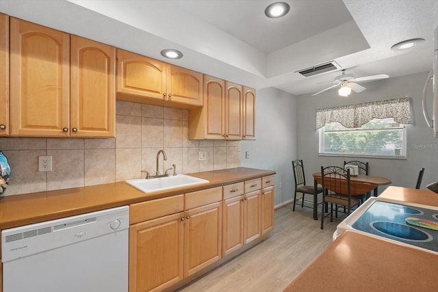 2503 Beneva Rd Unit 7, Sarasota, FL 34232 - kitchen featuring white appliances, a sink, light wood finished floors, decorative backsplash, and ceiling fan