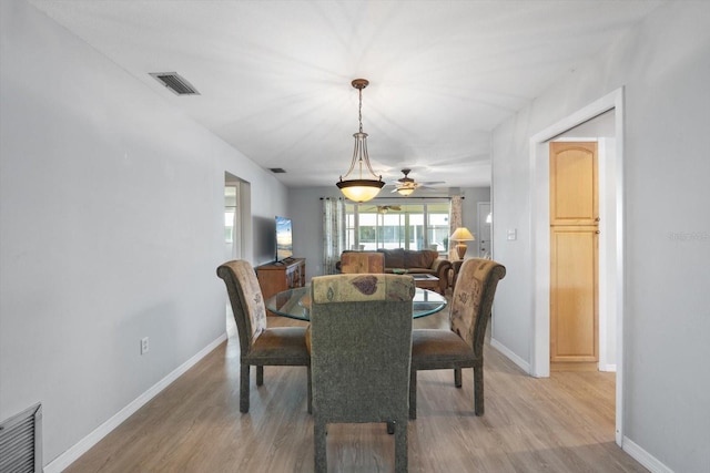 2503 Beneva Rd Unit 7, Sarasota, FL 34232 - dining room with light wood finished floors, baseboards, and a ceiling fan
