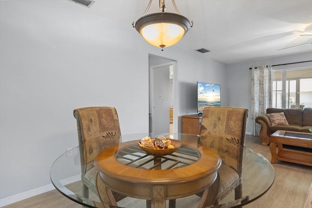 2503 Beneva Rd Unit 7, Sarasota, FL 34232 - dining room featuring light wood-style floors and baseboards