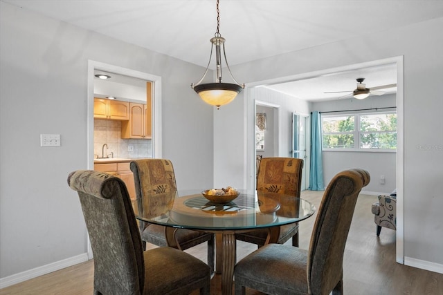 2503 Beneva Rd Unit 7, Sarasota, FL 34232 - dining area featuring baseboards, light wood-style flooring, and ceiling fan