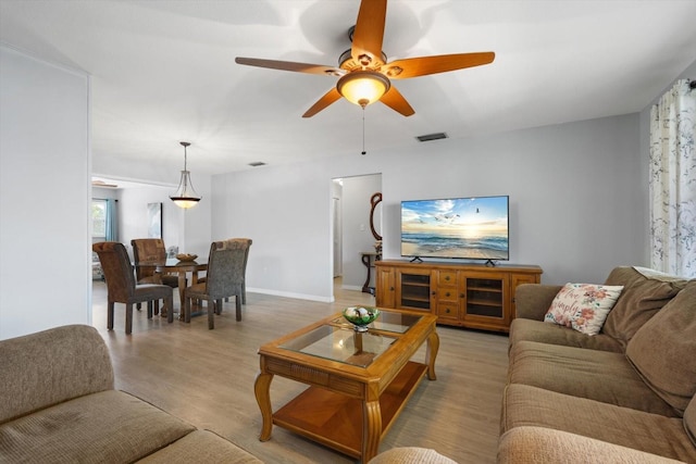 2503 Beneva Rd Unit 7, Sarasota, FL 34232 - living area featuring ceiling fan, light wood-style floors, and baseboards