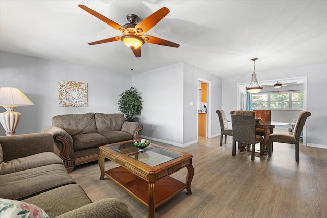 2503 Beneva Rd Unit 7, Sarasota, FL 34232 - living room with ceiling fan, wood finished floors, and baseboards