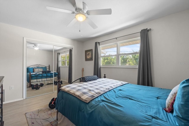 2503 Beneva Rd Unit 7, Sarasota, FL 34232 - bedroom featuring wood finished floors, a closet, ceiling fan, and baseboards