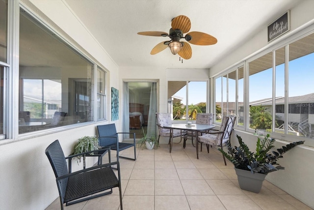 2503 Beneva Rd Unit 7, Sarasota, FL 34232 - sunroom with tile patterned flooring, a ceiling fan, and outdoor dining space