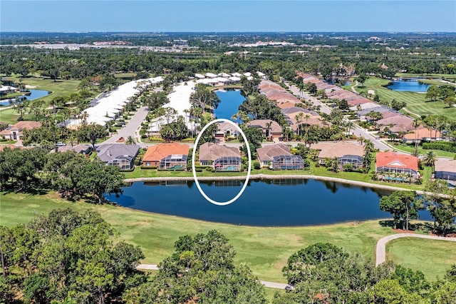 5205 88th St E, Bradenton, FL 34211 - aerial view of residential area featuring a golf club, a large body of water, and a tree filled landscape