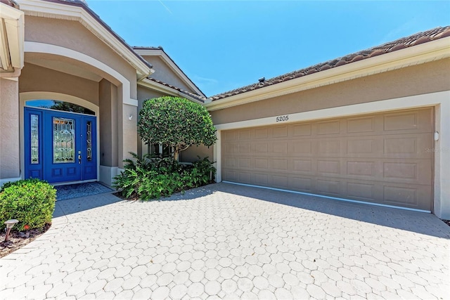 5205 88th St E, Bradenton, FL 34211 - entrance to property featuring decorative driveway and stucco siding