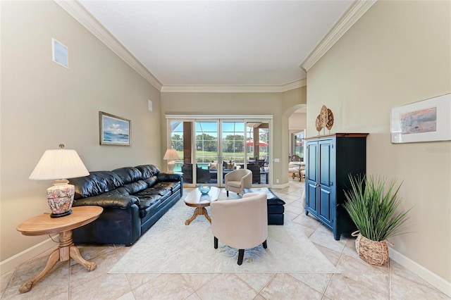 5205 88th St E, Bradenton, FL 34211 - living room featuring arched walkways, light tile patterned floors, crown molding, and baseboards