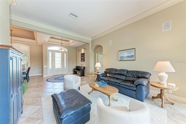 5205 88th St E, Bradenton, FL 34211 - living room featuring crown molding, arched walkways, baseboards, and light tile patterned flooring
