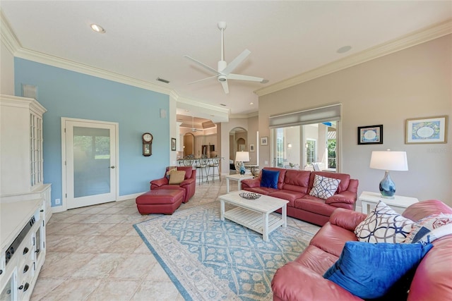 5205 88th St E, Bradenton, FL 34211 - living room featuring arched walkways, ceiling fan, crown molding, baseboards, and recessed lighting