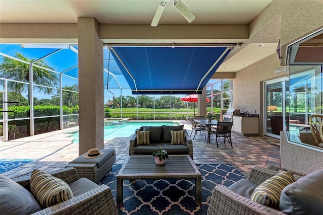 5205 88th St E, Bradenton, FL 34211 - view of patio with an outdoor hangout area, ceiling fan, a pool with connected hot tub, and a lanai