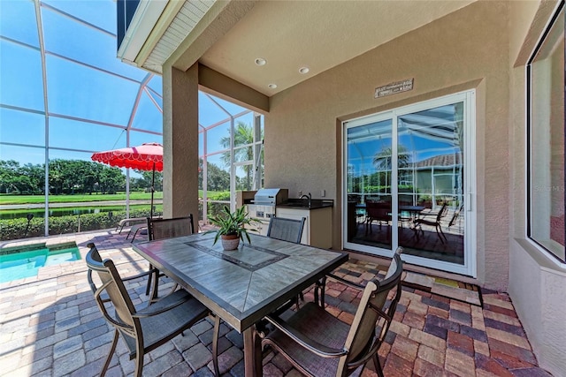 5205 88th St E, Bradenton, FL 34211 - view of patio / terrace featuring a lanai, outdoor dining space, and an outdoor pool