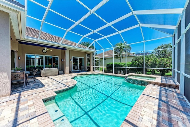 5205 88th St E, Bradenton, FL 34211 - view of pool featuring a patio, a pool with connected hot tub, outdoor lounge area, and a lanai
