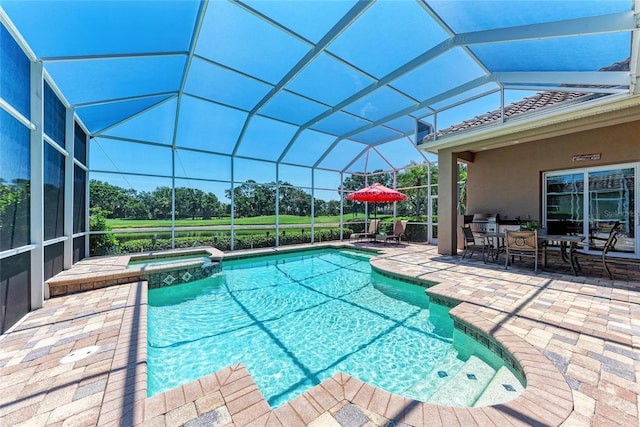 5205 88th St E, Bradenton, FL 34211 - view of pool with a patio, a pool with connected hot tub, outdoor dining area, a lanai, and view of wooded area