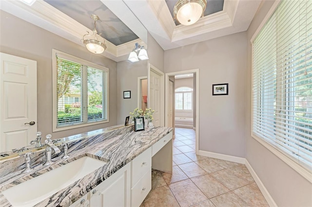 5205 88th St E, Bradenton, FL 34211 - bathroom with a tray ceiling, vanity, crown molding, tile patterned floors, and baseboards