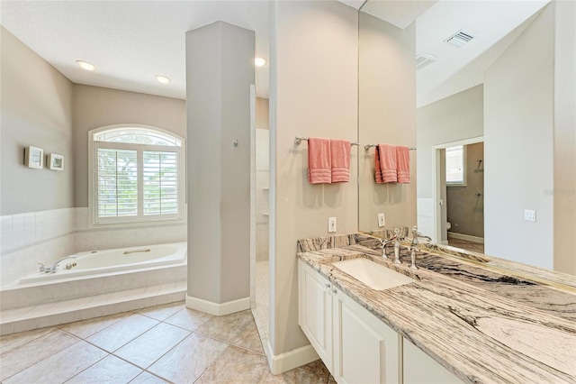 5205 88th St E, Bradenton, FL 34211 - bathroom with a garden tub, toilet, vanity, tile patterned flooring, and a walk in shower