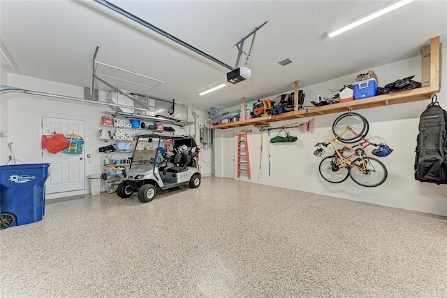 5205 88th St E, Bradenton, FL 34211 - garage with a garage door opener and electric panel