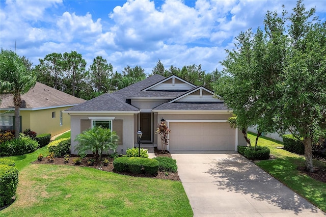 11794 Forest Park Cir, Bradenton, FL 34211 - view of front of property with roof with shingles, an attached garage, a front yard, and driveway
