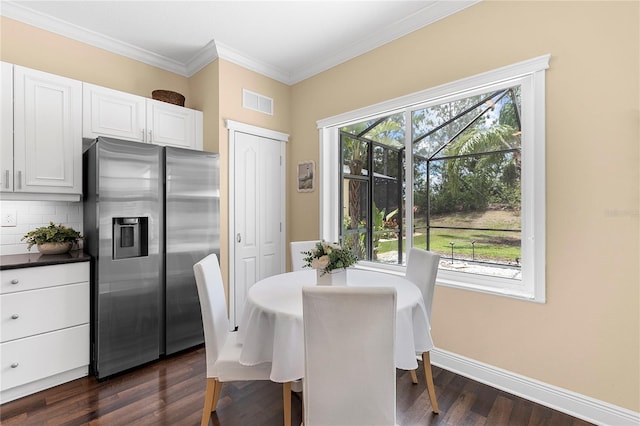 11794 Forest Park Cir, Bradenton, FL 34211 - dining room featuring dark wood-style flooring, baseboards, and crown molding