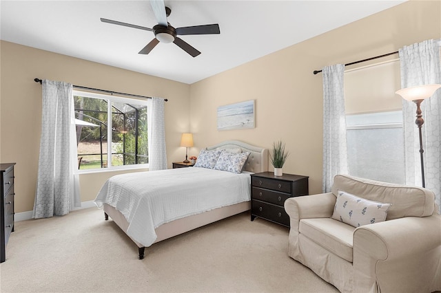 11794 Forest Park Cir, Bradenton, FL 34211 - bedroom with light carpet, baseboards, and a ceiling fan