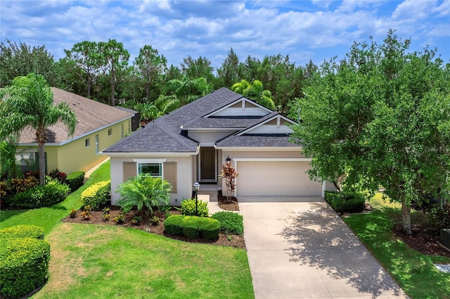 11794 Forest Park Cir, Bradenton, FL 34211 - view of front of house with roof with shingles, driveway, an attached garage, a front lawn, and stucco siding