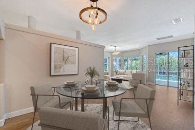 4603 4th Ave E, Bradenton, FL 34208 - dining space featuring baseboards and wood finished floors