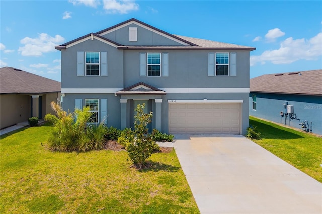 8656 40th Cir E, Palmetto, FL 34221 - view of front of home featuring an attached garage, stucco siding, a front lawn, and driveway