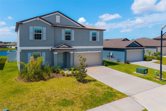 8656 40th Cir E, Palmetto, FL 34221 - traditional home featuring stucco siding, concrete driveway, a front yard, and an attached garage