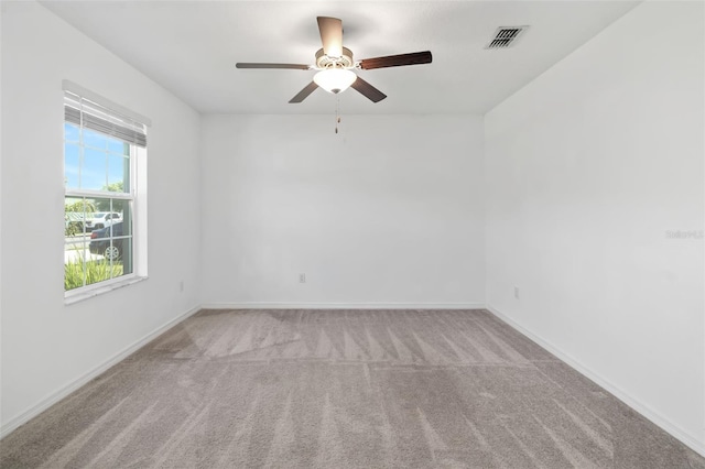 8656 40th Cir E, Palmetto, FL 34221 - spare room featuring carpet flooring, ceiling fan, and baseboards