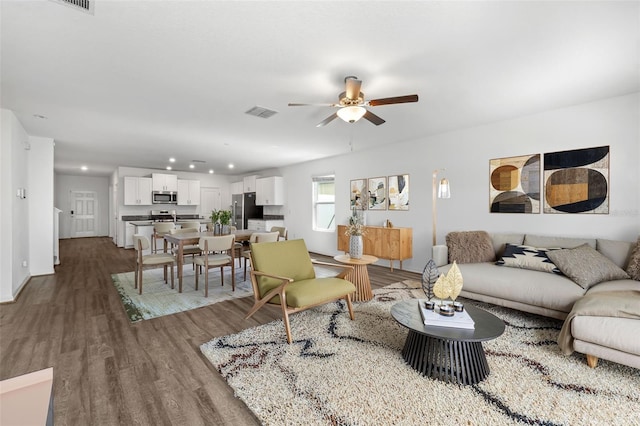 8656 40th Cir E, Palmetto, FL 34221 - living area with a ceiling fan, dark wood-style floors, recessed lighting, and baseboards