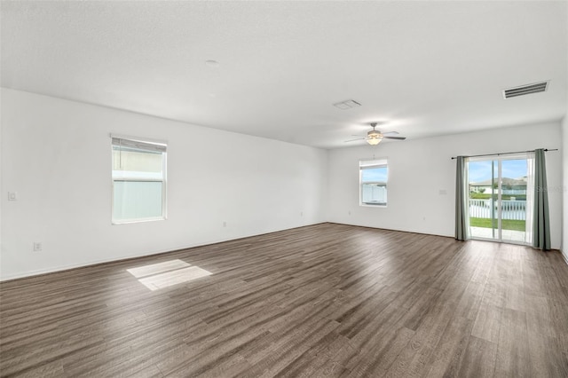 8656 40th Cir E, Palmetto, FL 34221 - spare room featuring wood finished floors and ceiling fan