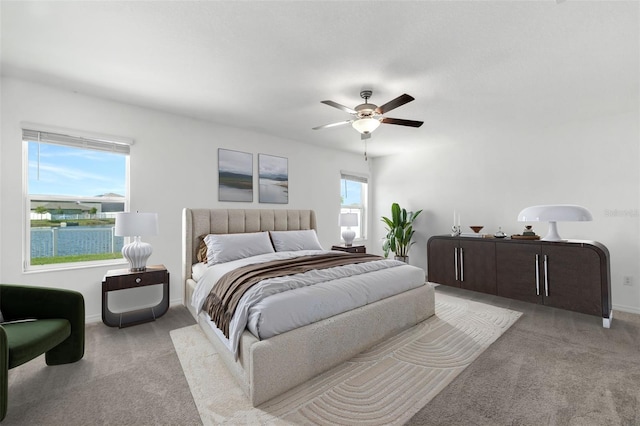8656 40th Cir E, Palmetto, FL 34221 - bedroom with carpet flooring, baseboards, and a ceiling fan