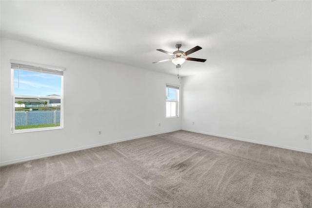 8656 40th Cir E, Palmetto, FL 34221 - carpeted spare room featuring baseboards and a ceiling fan