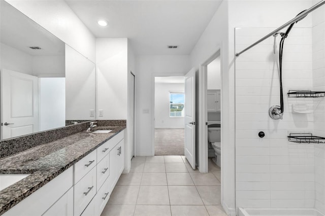 8656 40th Cir E, Palmetto, FL 34221 - bathroom with double vanity, a stall shower, toilet, and recessed lighting