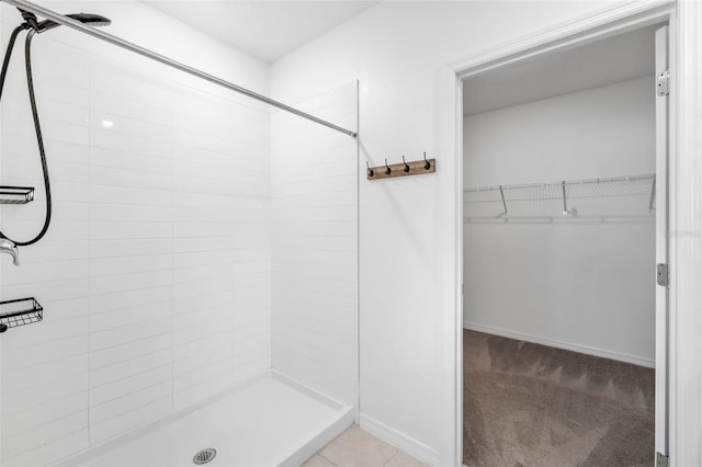 8656 40th Cir E, Palmetto, FL 34221 - full bath with tiled shower, a walk in closet, and baseboards