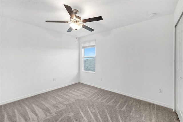 8656 40th Cir E, Palmetto, FL 34221 - carpeted spare room featuring baseboards, a ceiling fan, and a smoke detector