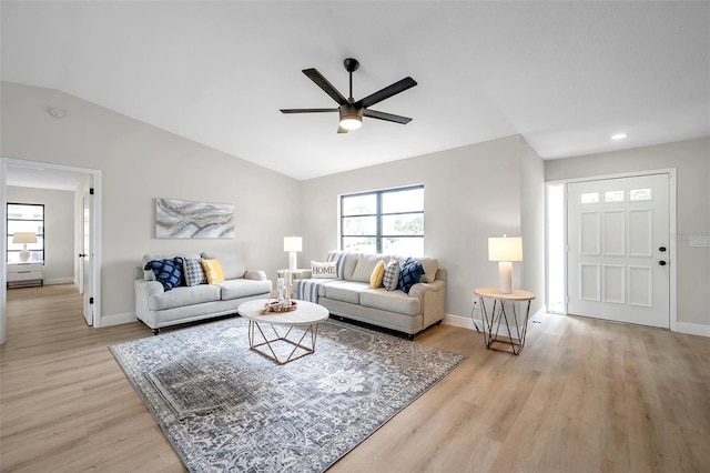 5125 Palm Aire Dr, Sarasota, FL 34243 - living room featuring a ceiling fan, vaulted ceiling, baseboards, light wood-style flooring, and recessed lighting