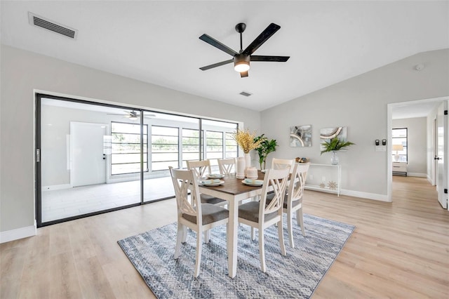 5125 Palm Aire Dr, Sarasota, FL 34243 - dining room featuring ceiling fan, lofted ceiling, light wood-type flooring, and baseboards