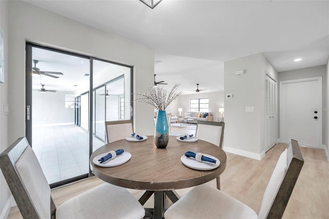 5125 Palm Aire Dr, Sarasota, FL 34243 - dining room with a ceiling fan, light wood-style flooring, and baseboards
