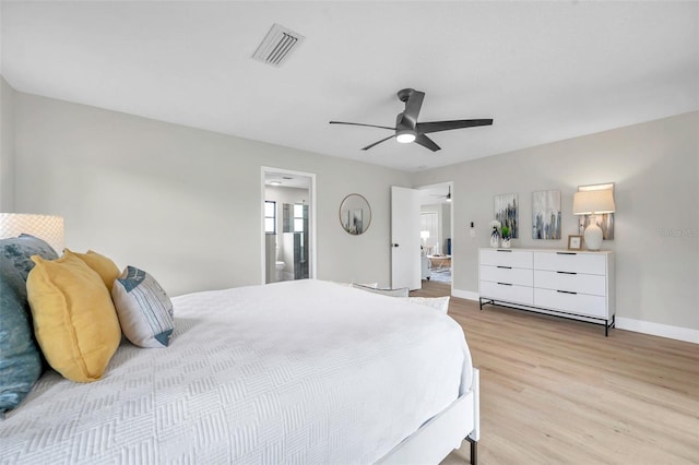 5125 Palm Aire Dr, Sarasota, FL 34243 - bedroom featuring light wood-style floors, baseboards, ensuite bathroom, and ceiling fan
