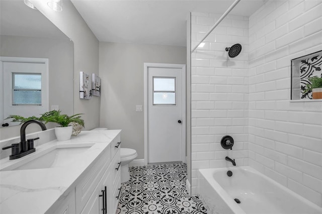 5125 Palm Aire Dr, Sarasota, FL 34243 - bathroom featuring vanity, tile patterned floors, shower / tub combination, toilet, and baseboards