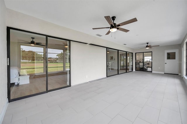 5125 Palm Aire Dr, Sarasota, FL 34243 - unfurnished sunroom with a ceiling fan and plenty of natural light