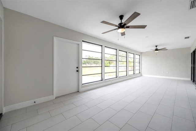 5125 Palm Aire Dr, Sarasota, FL 34243 - empty room featuring ceiling fan and baseboards