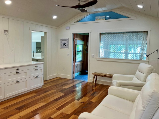4412 125th St W, Cortez, FL 34215 - living room with ceiling fan, light wood-style flooring, vaulted ceiling, recessed lighting, and baseboards