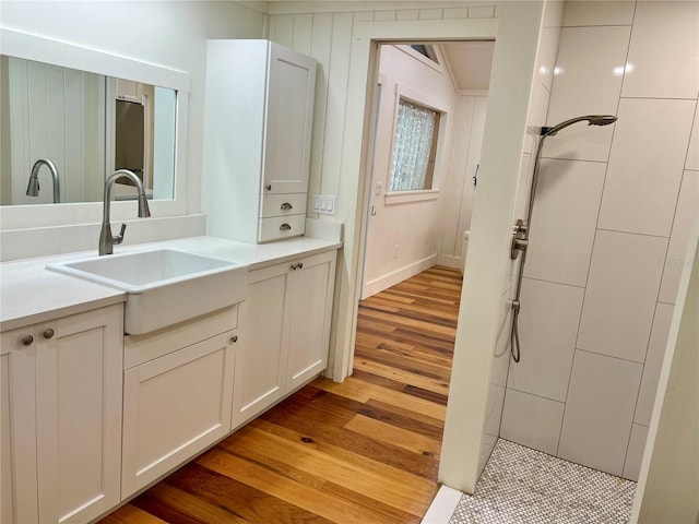 4412 125th St W, Cortez, FL 34215 - bathroom with vanity, wood finished floors, and a tile shower