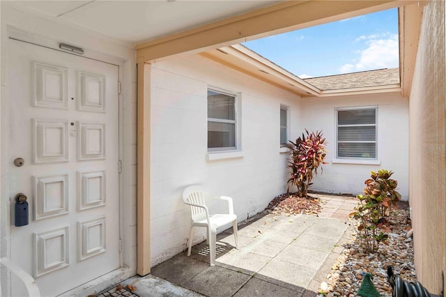 5062 White Oak Ct, Bradenton, FL 34207 - doorway to property featuring roof with shingles